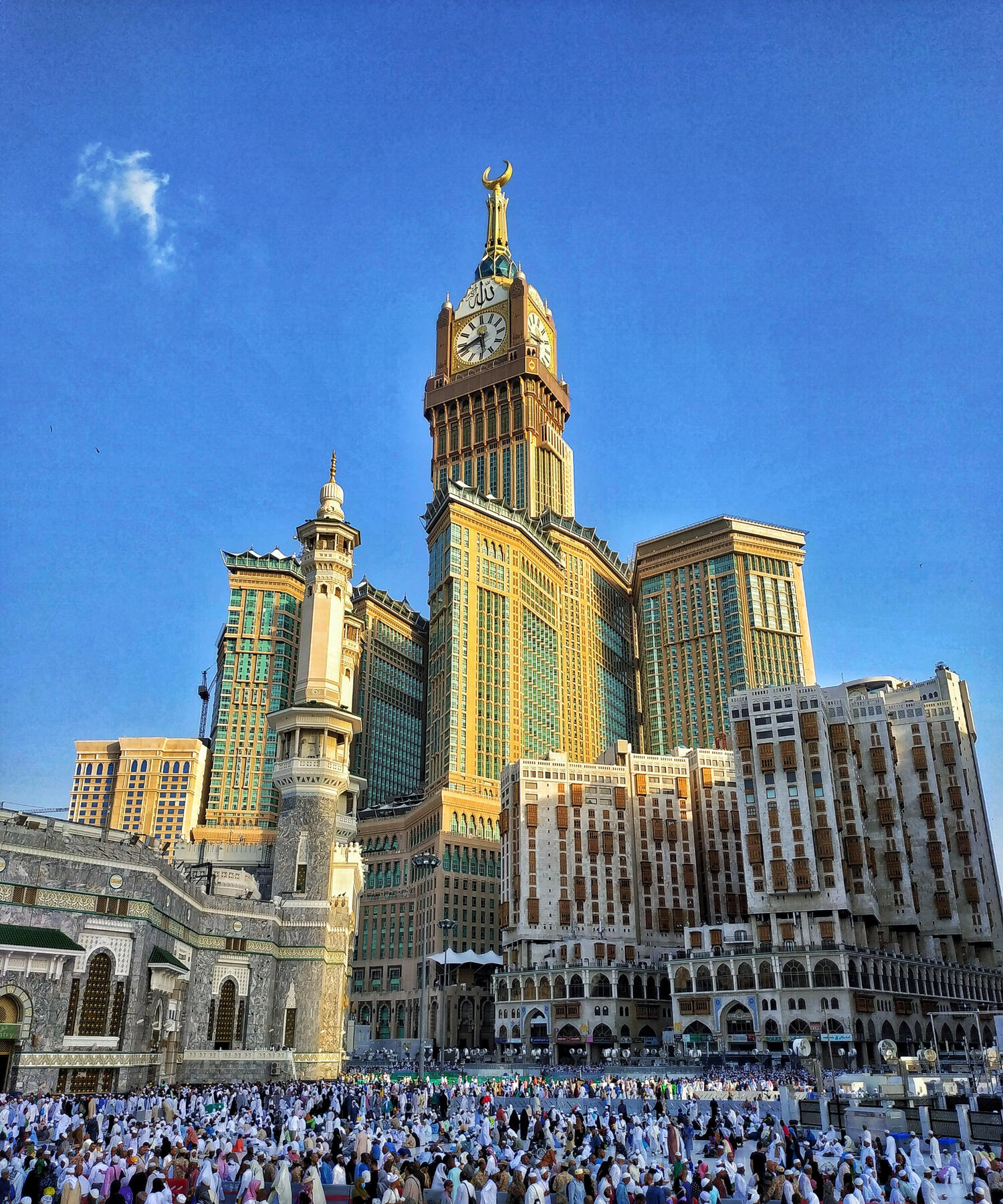 Mecca crowds and skyline outside worship temple, from Saudi Arabia Paid Media Agency